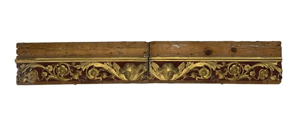 Wooden fragment with floral decorations.