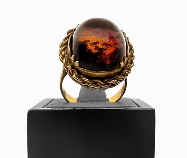 Red gold ring with stone