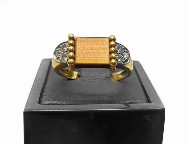 Gold ring and stones