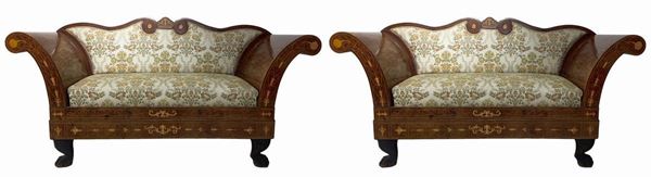 Pair of two-seater sofas in mahogany wood inlaids. XIX century., Boxed armrests, solid ferini feet with leaf decorations. ...