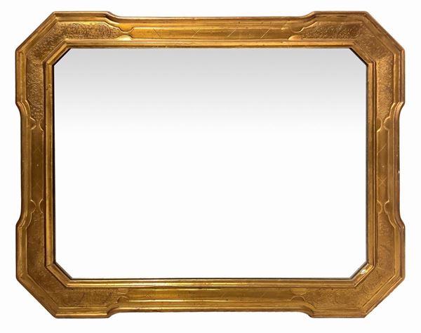 Golden mirror in golden rectangular wooden wood