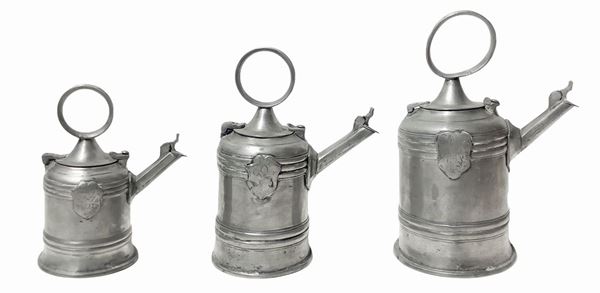 Triptych of antique pourers in solid pewter 95