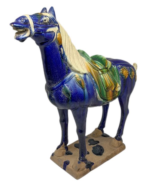 Ceramic horse in the colors of blue, China.
