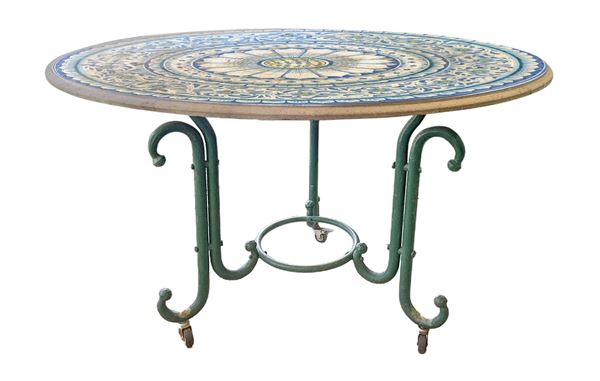 Round lava stone table and 4 wrought iron chairs.