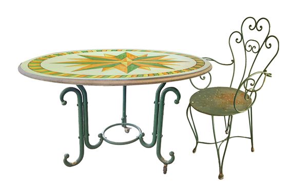 Round lava stone table and 4 wrought iron chairs