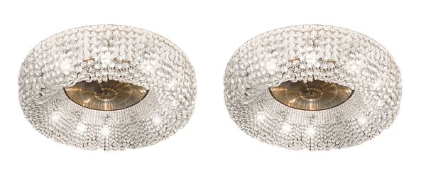 Pair of important brass ceiling lights with rosette toasts.