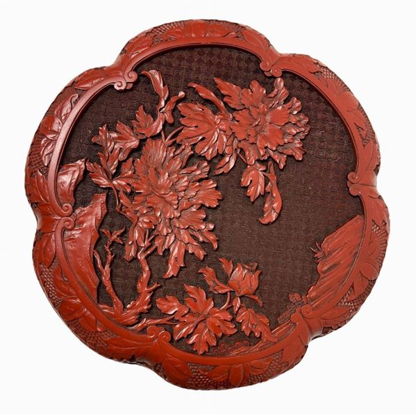 Lacquered box in China red. Low relief floral decoration.