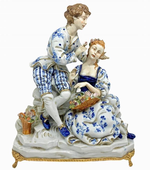 Capodimonte - Porcelain figurine depicting a gallant couple with basket