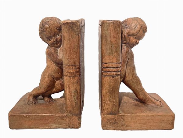 Pair of bookends with children