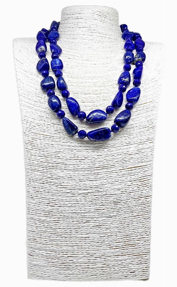 Necklace with two lapis lazuli strands with faceted spheres alternating with smooth stone.