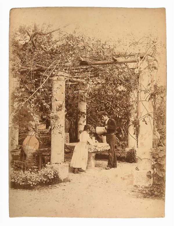 Wilhelm Von Gloeden - Little girl and man in a pergola