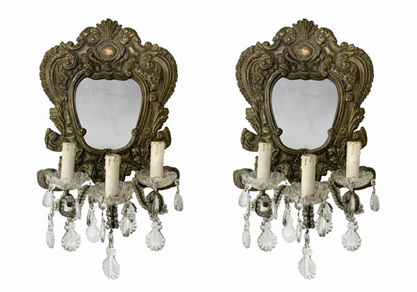 Pair of small mirrors with three lights.
