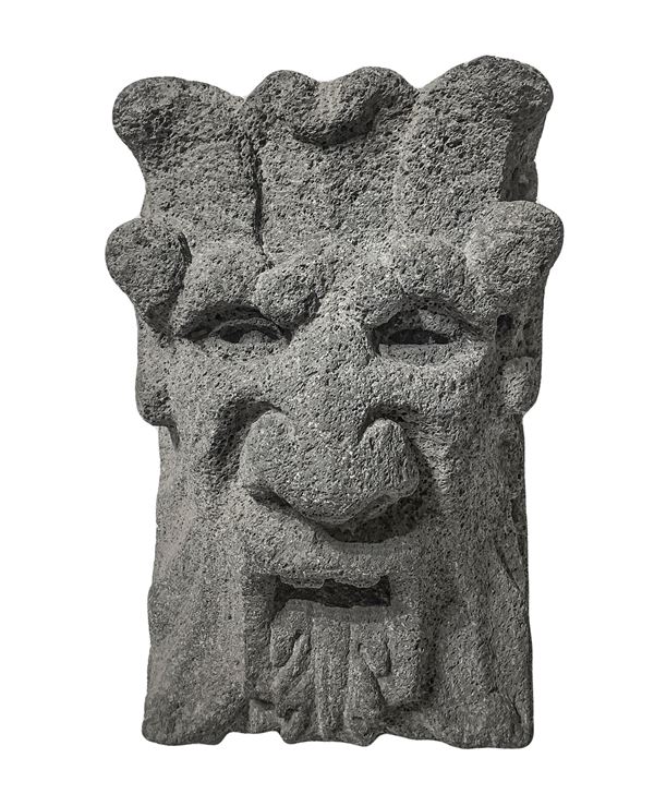 Lava stone key depicting mask