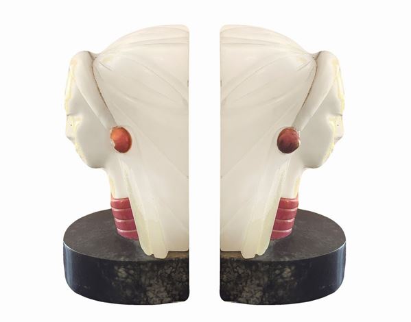 Pair of book-holdersin alabaster with female figures