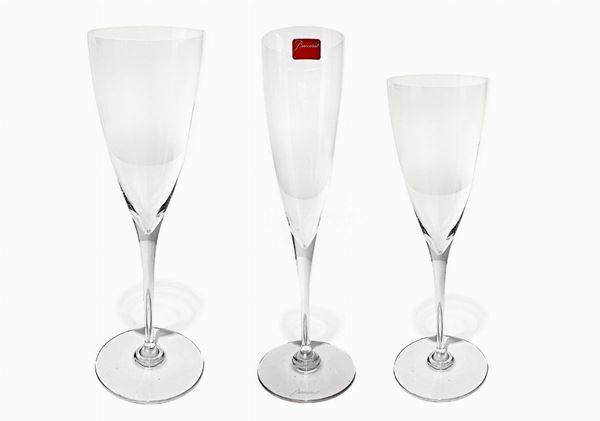 Baccarat, Dom Perignon glasses service. Composed of 24 flute: 8 flute champagne, 8 water, 8 wine.
 Delivered 9 flute, 10 water and 12 wine