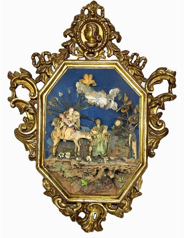 Fuga in Egitto in teca,  in cera e stoffa, Sicilia, Trapani, metà del XVIII secolo. Teca coeva Luigi XV in legno dorato Luigi XV. H cm 47 x35, profondità cm 7. 