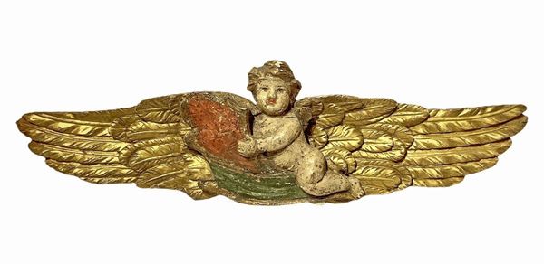 Sculpture with polychrome angel in lacquered wood and gold leaf. Cm 26x90