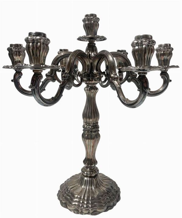 Silver candelabra with seven lights, the twentieth century, punch silversmiths Ricci & Co, Alexandria (1935). Weight Kg 2,175. H 47 cm, max 47 cm diameter.
