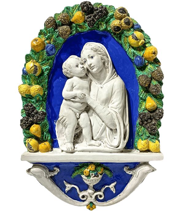 Majolica depicting Virgin Mary with child, the end of the nineteenth century. Copy of "Della Robbia". H 93 cm width 62 cm depth 12 cm

