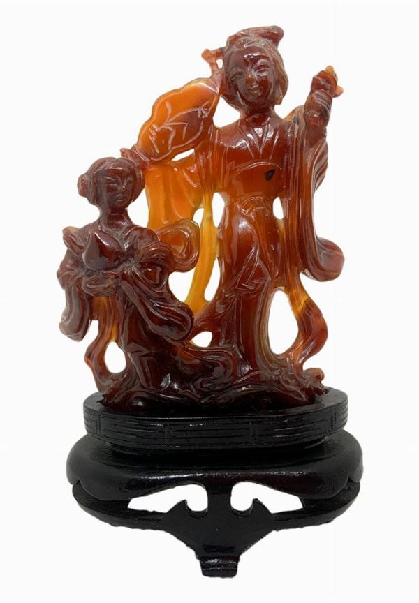 Statuette of brown carnelian depicting "Motherhood" (Guanine with daughter). H 11. H cm with base 15. cm width 7 cm.