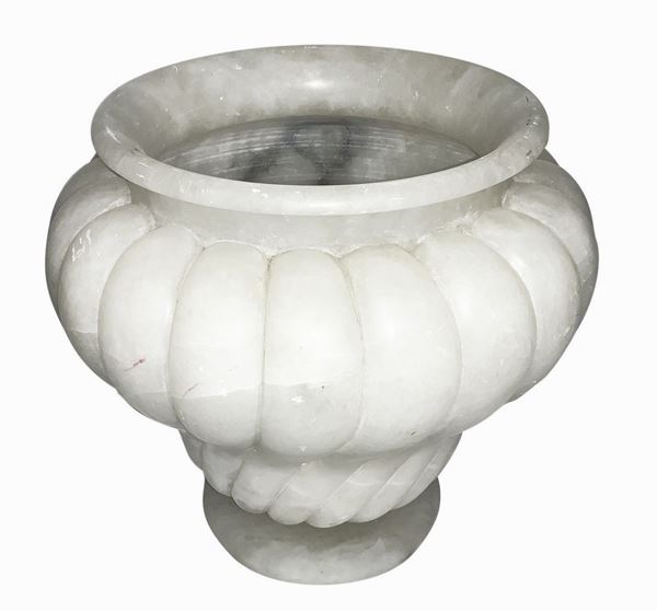French production. 1920s. Cachepot in white alabaster Lenticular foot, ribs along the central body, signs of use. H 35 cm, diameter ...