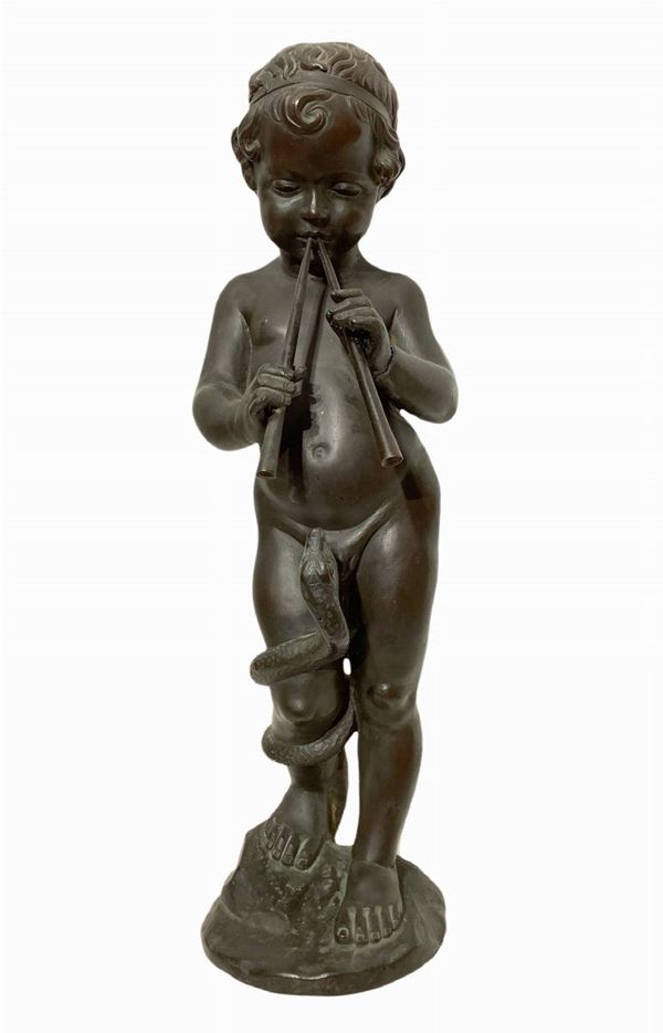Bambino incantatore di serpente