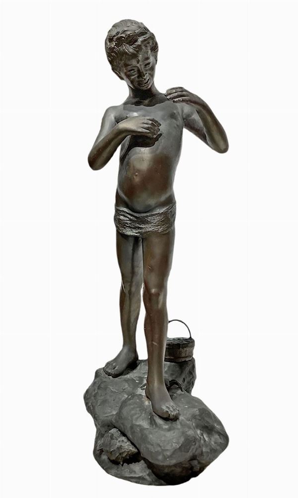 Sculpture depicting a young fisherman