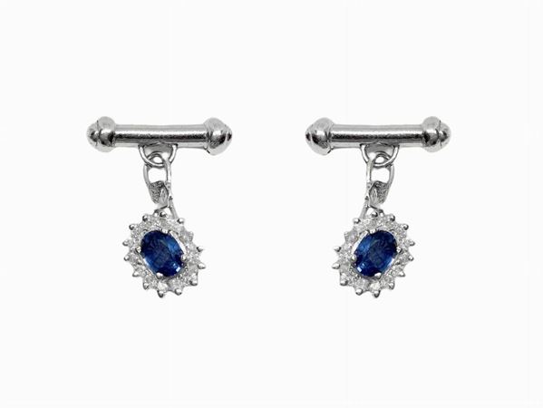 White gold women's cuffs with central sapphires surrounded by diamonds