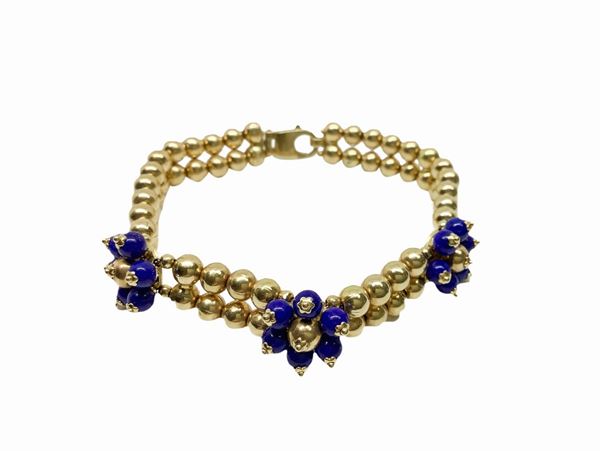 Two-strand beaded sphere bracelet in yellow gold and blue stones