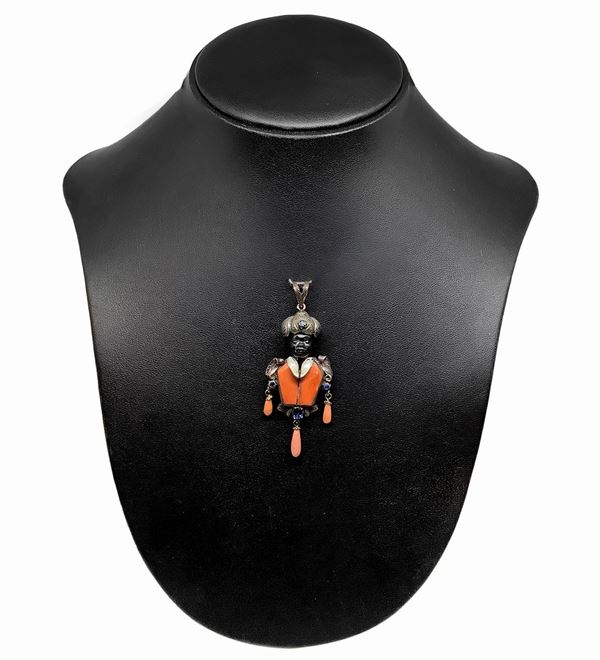 Dark brown pendant in low title gold, silver and coral