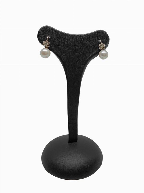 Orecchini con perle e diamante