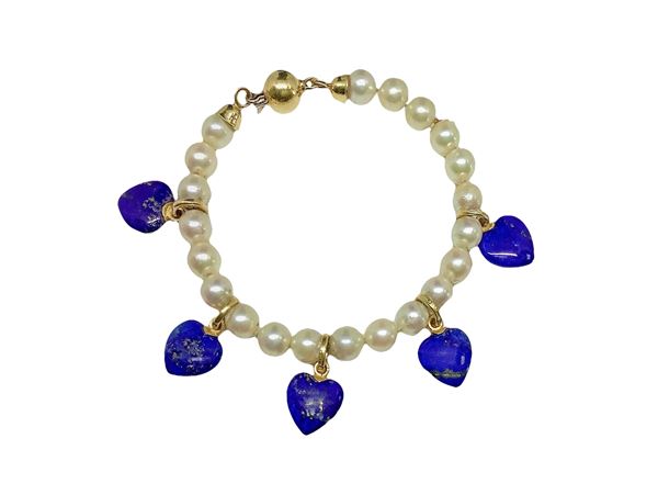 Bracelet with heart-shaped pendants