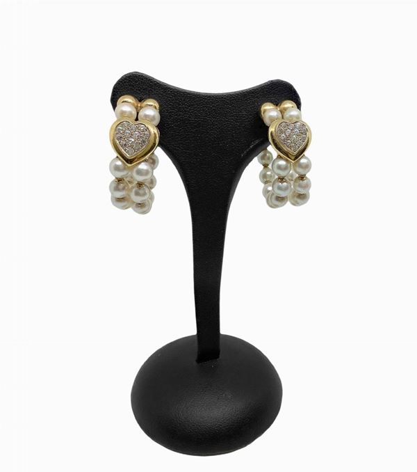 Hoop earrings with heart-shaped decoration