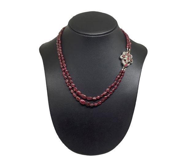 Silver necklace with rubies and silver and ruby clasp.