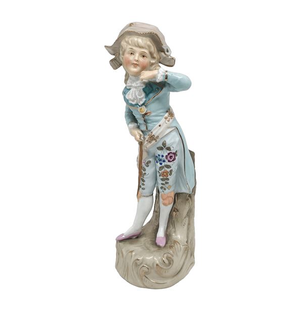 Polychrome biscuit figurine depicting a child in eighteenth-century clothes