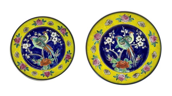 Number two Chinese saucers depicting birds on a blue and yellow background