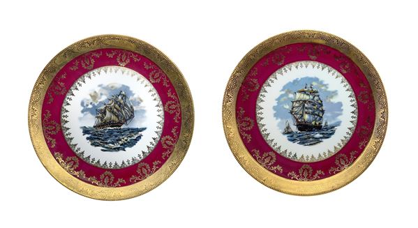 Limoges - Pair of bordeaux and gold porcelain plates with a galleon in the centre