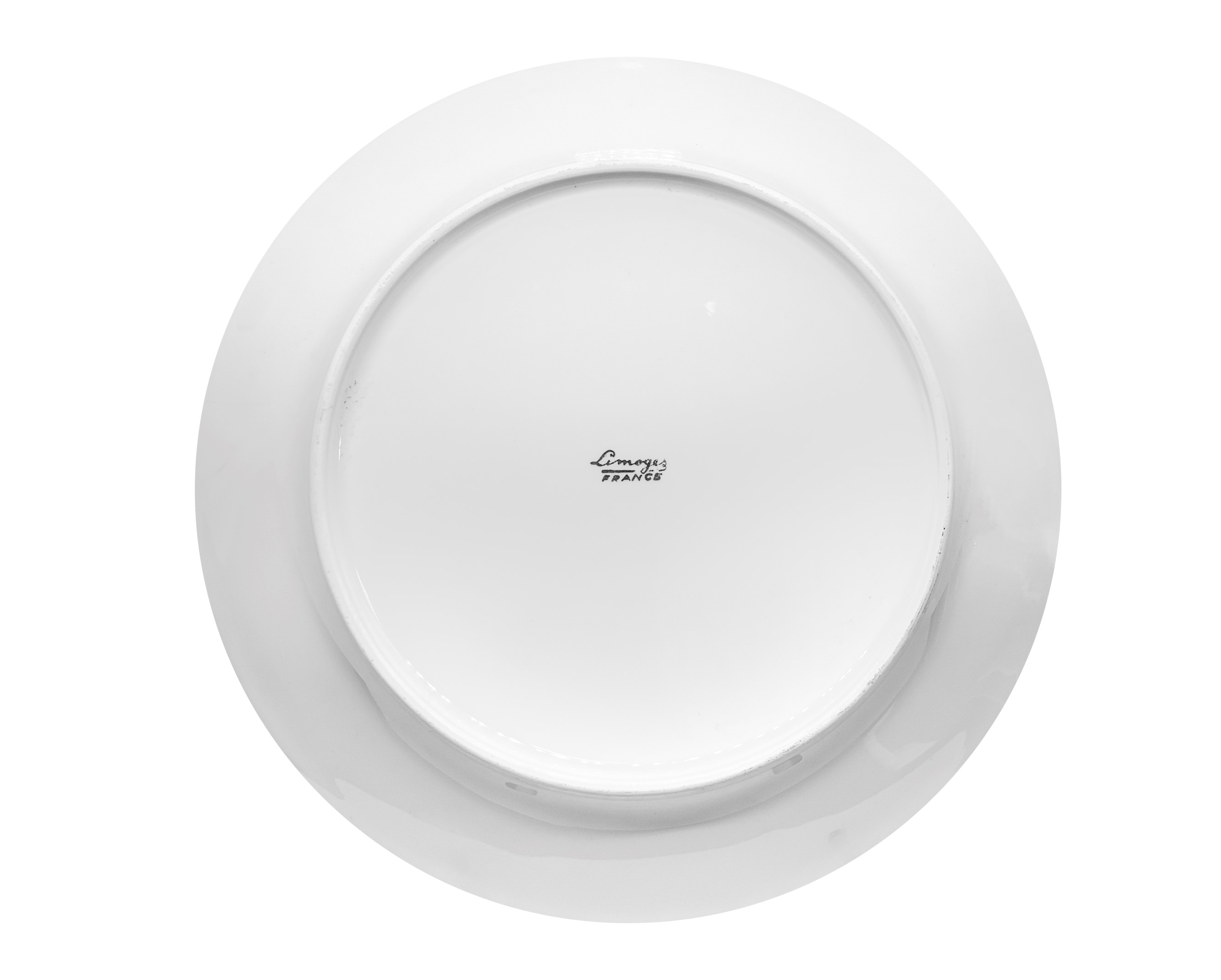 Coppia di piatti in porcellana bordeaux e oro con un galeone al centro