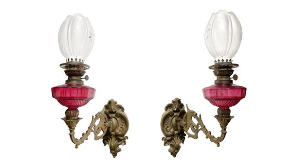 Pair of bronze and glass oil lamps
