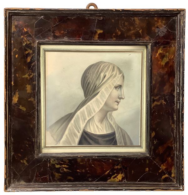 Profile of a woman with a veil in a turtle frame