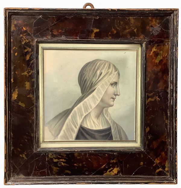 Profile of a woman with a veil in a turtle frame