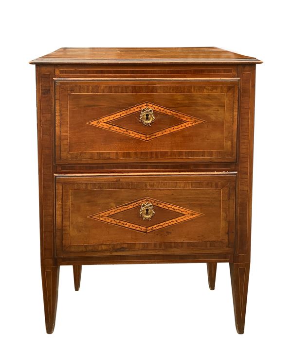 Late Louis XVI bedside table with two drawers in walnut with lozenges on the front, top and sides and truncated pyramidal feet