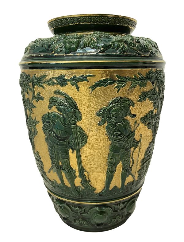 Green and gold majolica vase with representation of grape branches and characters