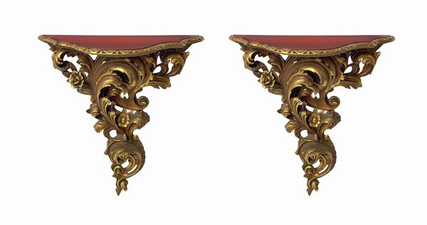 Pair of wall shelves in gilded wood