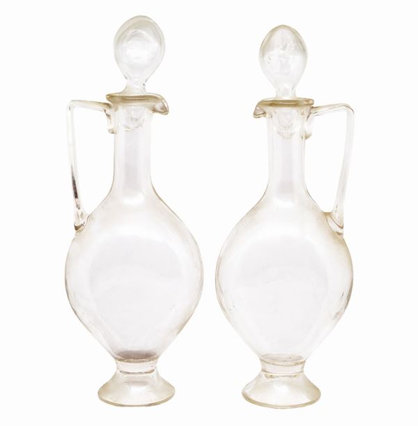 Pair of antique pourers