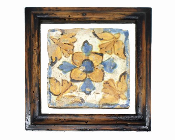 Caltagirone majolica tile, with floral decoration in shades of yellow and blue