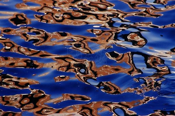 Collection AQUA, titled "East River Eyes", 2006. USA: NYC, Reflection of red brick buildings on the East River, slide 1/5, 70x100, Digital Fine Art print on Kodak photo paper mat, forex black 20mm, edged