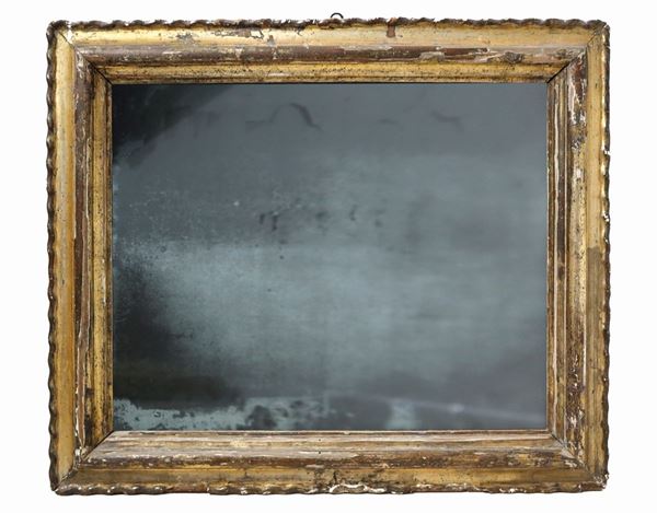 Rectangular mirror in gilded leaf wood