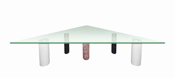 Low triangular table with support feet formed by cylindrical geometric elements in marble