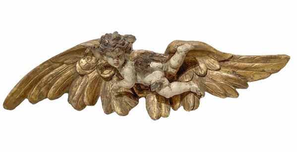 Sculpture with polychrome angel in lacquered wood and gold leaf. Cm 19x60